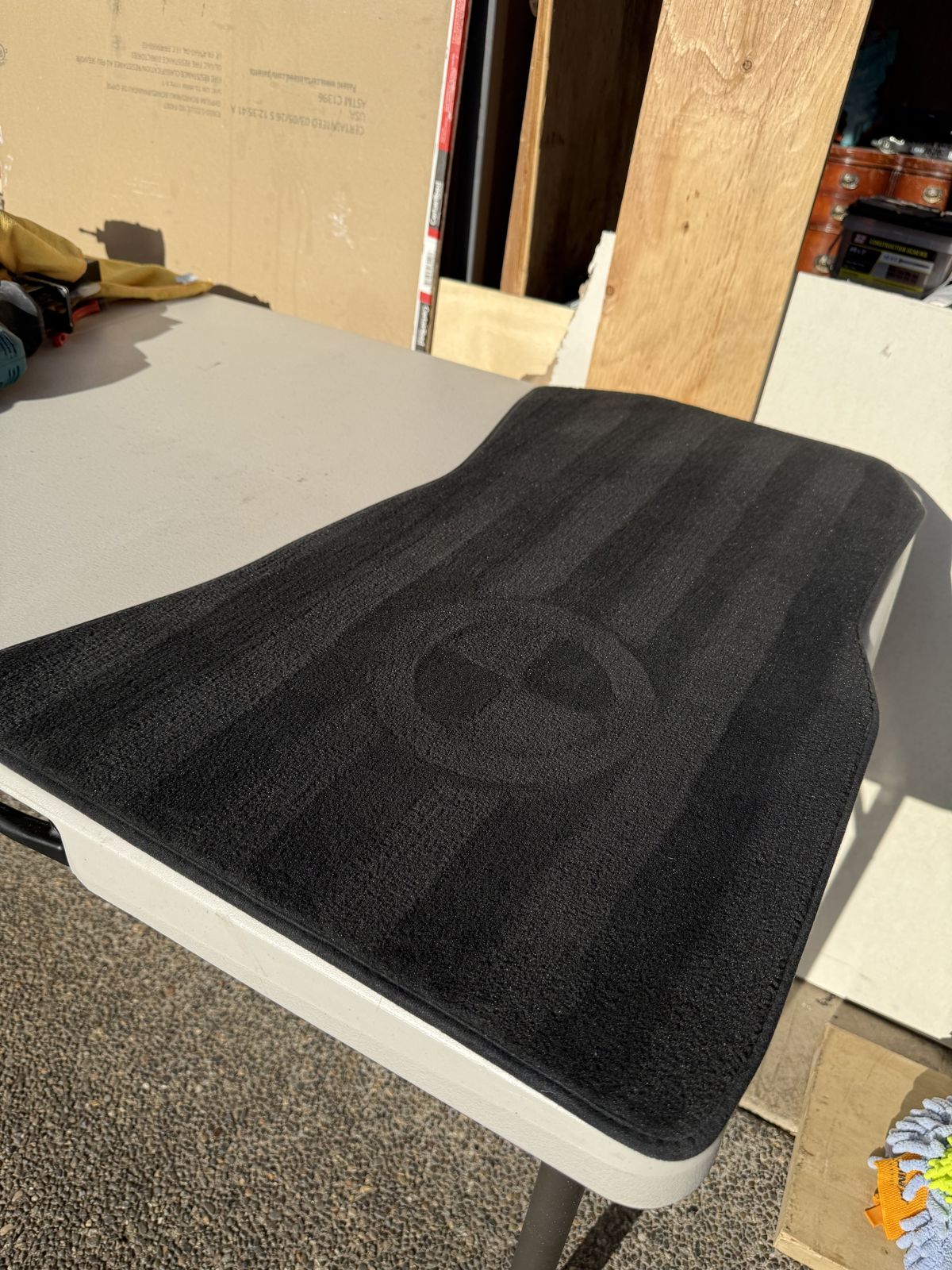 Black floor mat deep cleaned to like-new condition